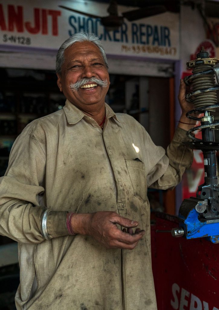 Smiling owner of an Indian MSME workshop