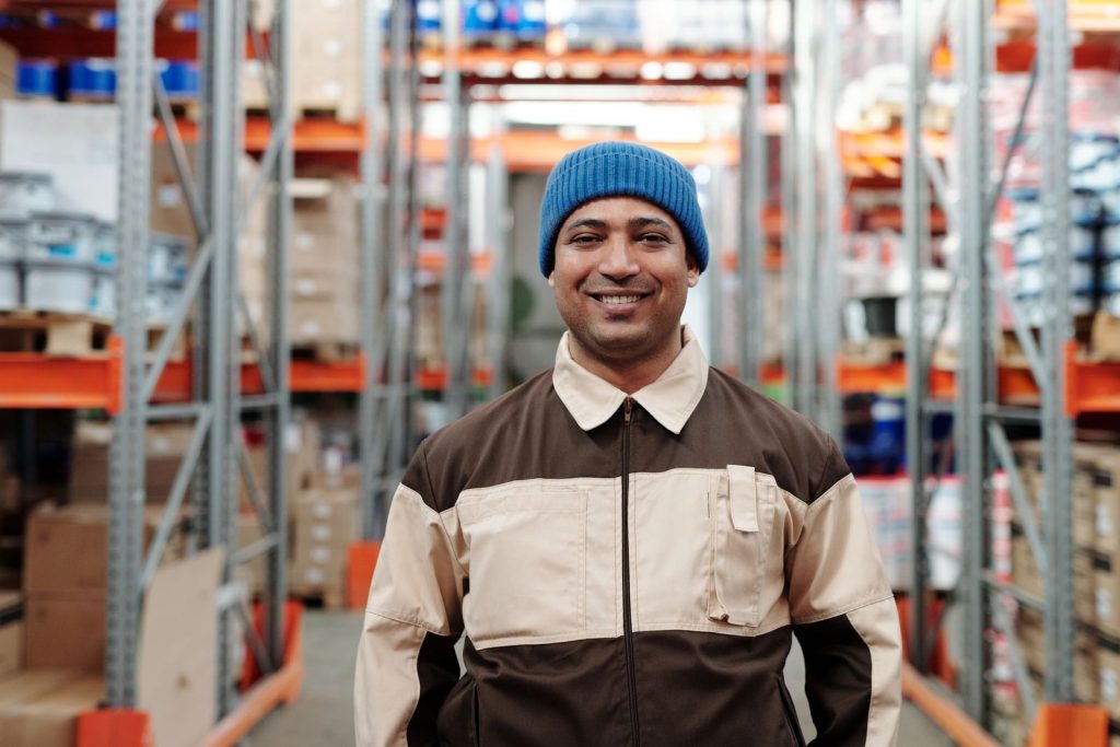 Smiling worker at an Indian wholesale warehouse